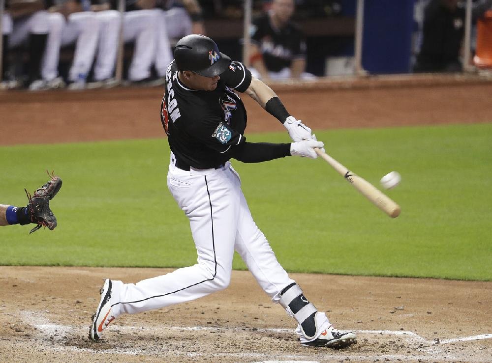 Miami Marlins' Brian Anderson runs the bases after hitting a two-run home  run during the fourth inning of a baseball game against the Milwaukee  Brewers, Saturday, May 14, 2022, in Miami. (AP