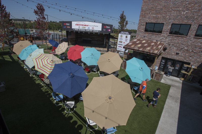 File photo/NWA Democrat-Gazette/J.T. WAMPLER Customers have lunch Sept. 11 at JJ's Beer Garden and Brewing Co. in Fayetteville.