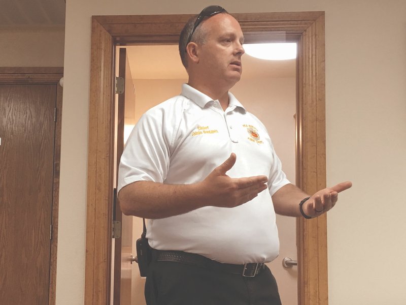 TIMES photographs by Andrea Johnson Fire Chief Jamie Baggett spoke to the Pea Ridge Optimist Club Thursday, July 19, about challenges the Pea Ridge Fire Department faces.