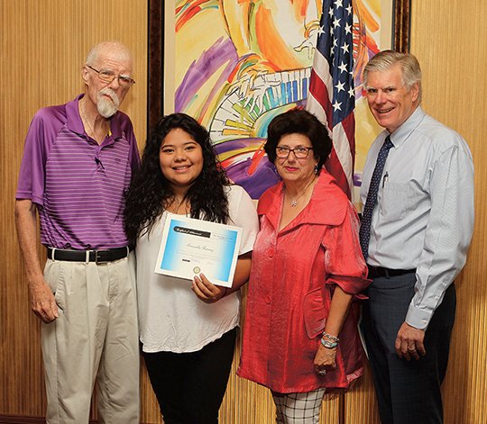 The Sentinel-Record/Richard Rasmussen SPECIAL SCHOLARSHIP: Esmeralda Ramirez, second from left, accepts a scholarship from the Sunrise Rotary Club of Hot Springs on Tuesday presented by Adrianne Kahn Jewelers in honor of Dick Antoine. Also pictured are, from left, Antoine, Kahn and Mayor Pat McCabe.