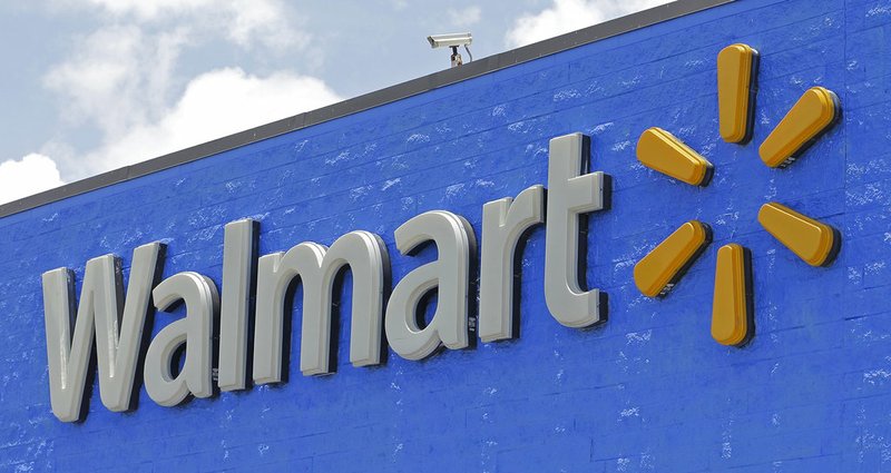 FILE - This June 1, 2017, file photo, shows a Walmart sign at a store in Hialeah Gardens, Fla. (AP Photo/Alan Diaz, File)