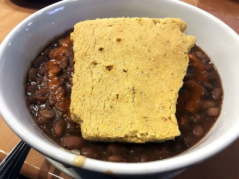 Sweet cornbread atop the Arkansas Hot Tamale bowl is shaped like the state at TAE. 