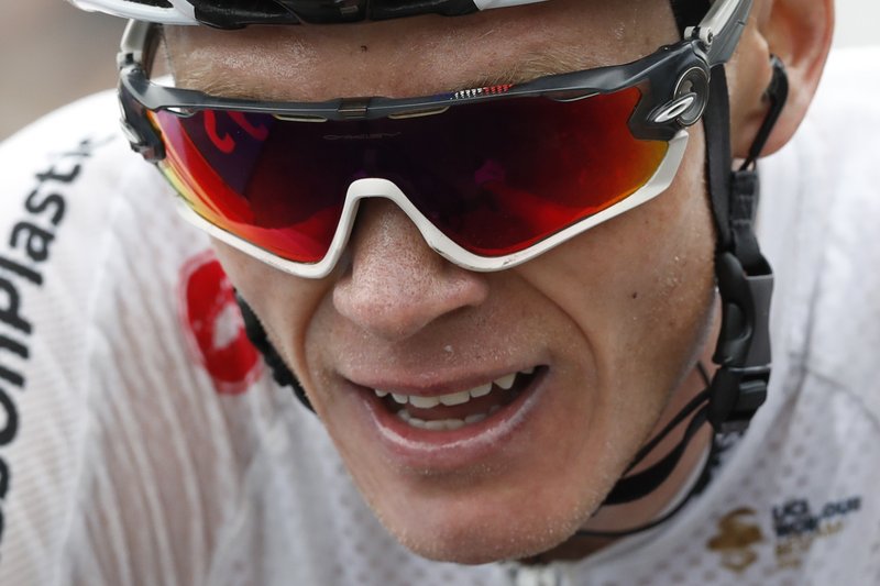 The Associated Press ROUGH RIDE: Britain's Chris Froome crosses the finish line of the seventeenth stage of the Tour de France over 40.4 miles with start in Bagneres-de-Luchon and finish in Saint-Lary-Soulan, Col du Portet pass, France, Wednesday. The Tour de France thinks it has some solutions to liven up the action with today's shorter mountain stage with three grueling climbs, including an uphill finish, intermediate bonus sprints and a Formula One-like grid start.
