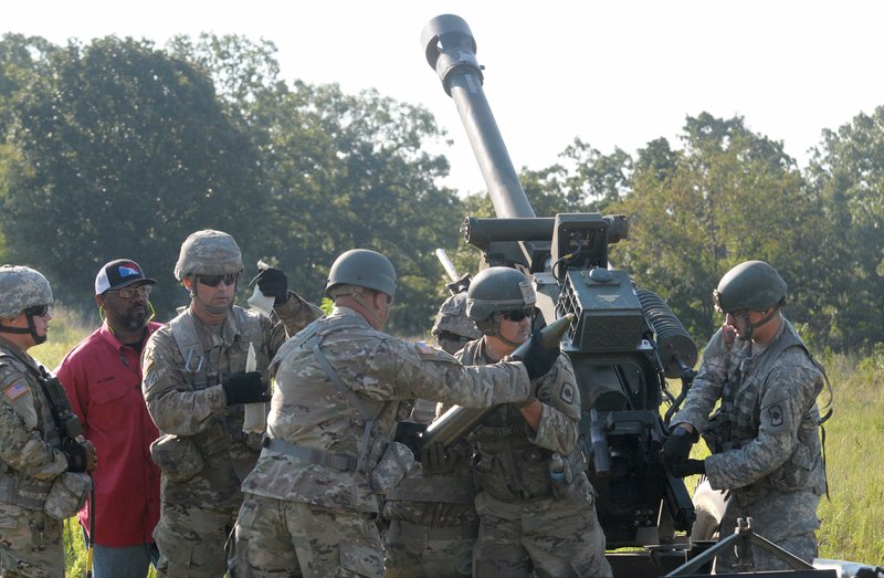 A gun crew with the 206 Field Artillery Regiment of the Arkansas National Guard participate Wednesday, July 25, 2018, in a live fire training operation with the L119A3 105mm towed Howitzer at Fort Chaffee Joint Maneuver Training Center.