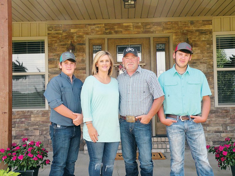 The Travis Sims family of the Cedar Creek community in Conway County is the 2018 Western District Farm Family of the Year. They are also the 2018 Conway County Farm Family of the Year. Members of the Sims family include Cordell, from left, Valerie, Travis and Will.