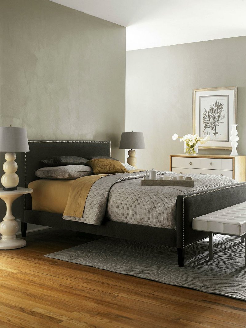 Sherwin-Williams color Rare Gray (SW 6199) is shown on this bedroom’s walls.  
