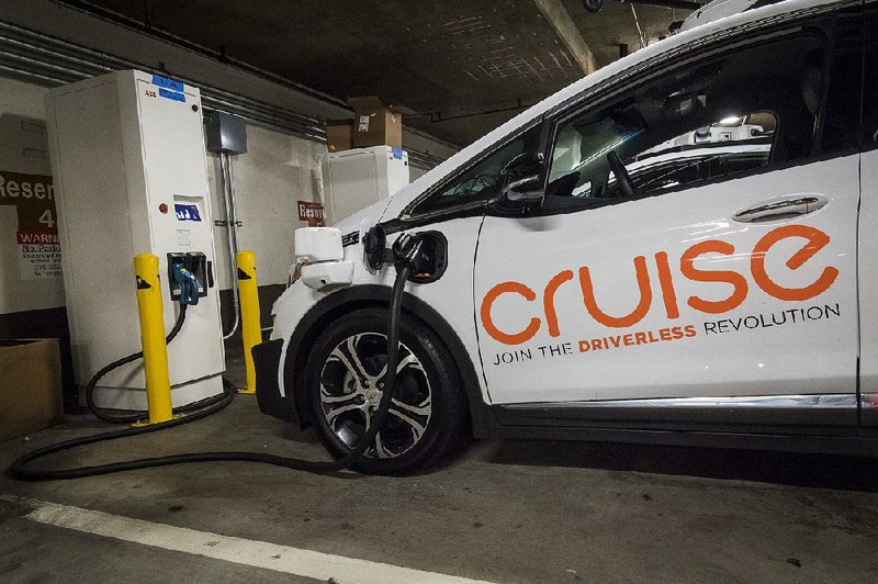 A General Motors Cruise autonomous test vehicle is parked at a charging station in San Francisco earlier this month.