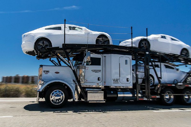 Tesla Inc. vehicles leave the company’s factory in Fremont, Calif., in June. The automaker is trying to turn out 5,000 of its new Model 3’s every week. 