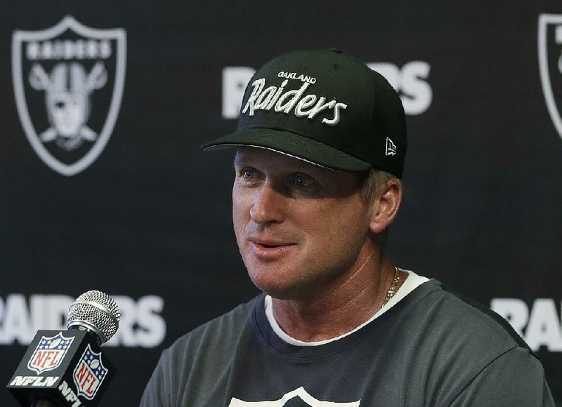 Oakland Raiders head coach Jon Gruden responds to a question at the NFL football team's mini-camp, Tuesday, June 12, 2018, in Alameda, Calif. Gruden coached the Raiders from 1998 through 2001before being traded to Tampa Bay. (AP Photo/Rich Pedroncelli)