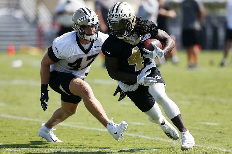 Alvin Kamara of the New Orleans Saints runs with the ball during Pro Bowl  NFL football practice …