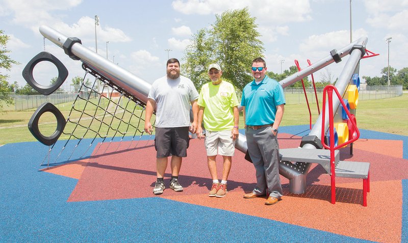 From left, Searcy Parks and Recreation employees Will Walker and Randy Rudesilla, along with Parks Director Mike Parsons, stand in front of the new HyPar Net play structure near the Searcy Event Center on Higginson Street. Parsons said the apparatus, which is missing the center climbing net, is ideal for older children and teenagers to use. He said this is the first phase of installing ninja-warrior-type equipment at the site.