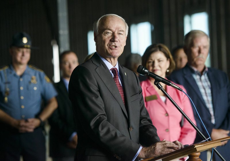 Gov. Asa Hutchinson speaks Friday at the location of the new Arkansas State Police headquarters in Lowell. Hutchinson announced plans for a state crime lab there.