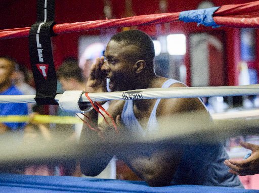 NWA Democrat-Gazette/CHARLIE KAIJO

Bernard Oliver shouts directions to fighters during a sparring event at Straightright Boxing and Fitness center in Springdale. Oliver is a coach and amateur boxer who has his eye on the 2020 Summer Olympics in Japan.
