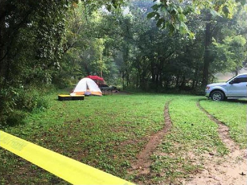 Tire tracks from Jonathan Bolger’s pickup are seen at his campsite at Spring Creek Campground in this National Park Service image taken Aug. 20, 2017, after Bolger was shot by a park ranger. Bolger had driven off in a rage earlier, then returned and apologized, his girlfriend said. 