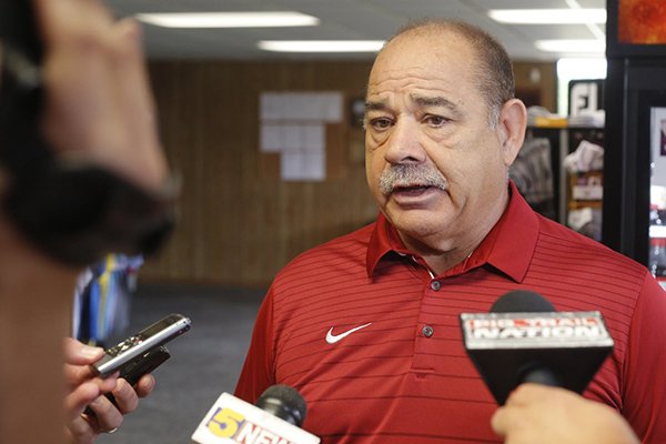 Arkansas defensive coordinator John Chavis talks to reporters Monday, July 30, 2018, in Fayetteville. 