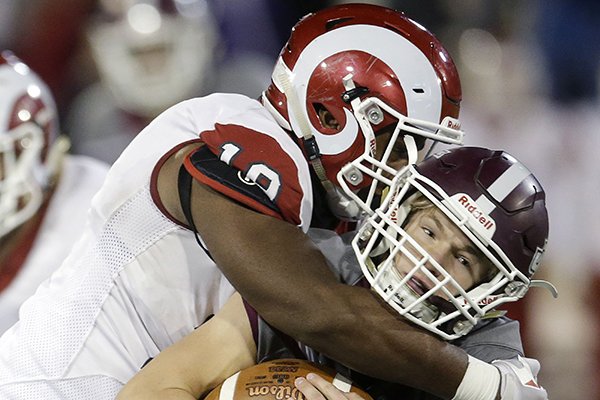 Owasso defensive lineman Courtre Alexander sacks Jenks quarterback Ian Corwin during a game Nov. 18, 2017, at HA Chapman Stadium in Tulsa, Okla. Alexander was one of four defensive linemen signed in Chad Morris' first signing class at Arkansas. 