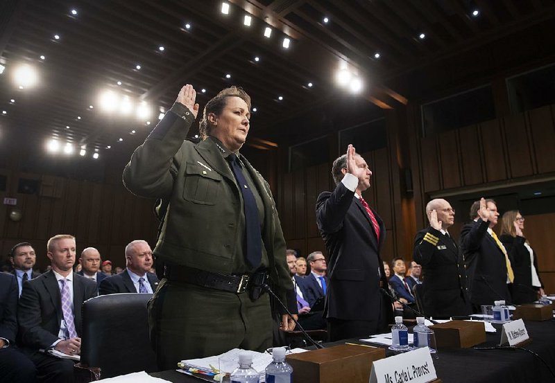 Carla Provost, acting chief of the U.S. Border Patrol, and Matthew Albence of U.S. Immigration and Customs Enforcement are sworn in to testify Tuesday before the Senate Judiciary Committee.