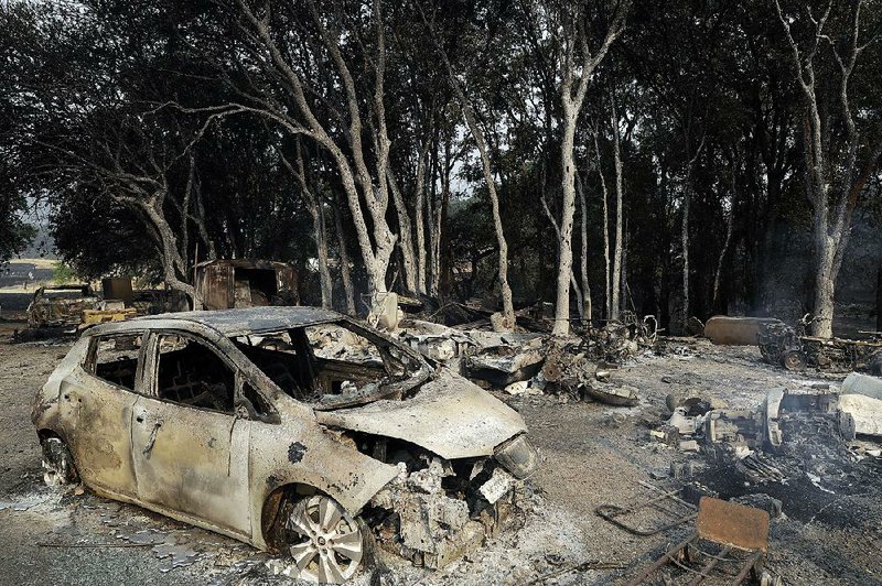 Flames consumed this homesite Tuesday in Lakeport, Calif. The California Department of Forestry and Fire Protection said Tuesday that fire crews had slowed the spread of the wildfire in the Lakeport area.

