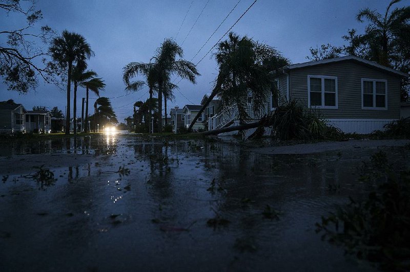 Houses hit by Hurricane Irma sit in floodwaters in the Gulf Coast city of Bonita Springs, Fla., in this Sept. 10, 2017, photo.
