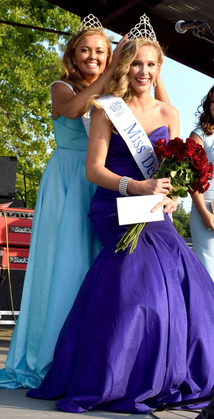 Westside Eagle Observer/MIKE ECKELS Sara Garner (left) crowns Starling Ledbetter, Miss Decatur Barbecue 2018, at Veterans Park in Decatur Aug. 5, 2017. Ledbetter will crown a new Miss Decatur Barbecue during the 65th annual event at Veterans Park Aug. 4.