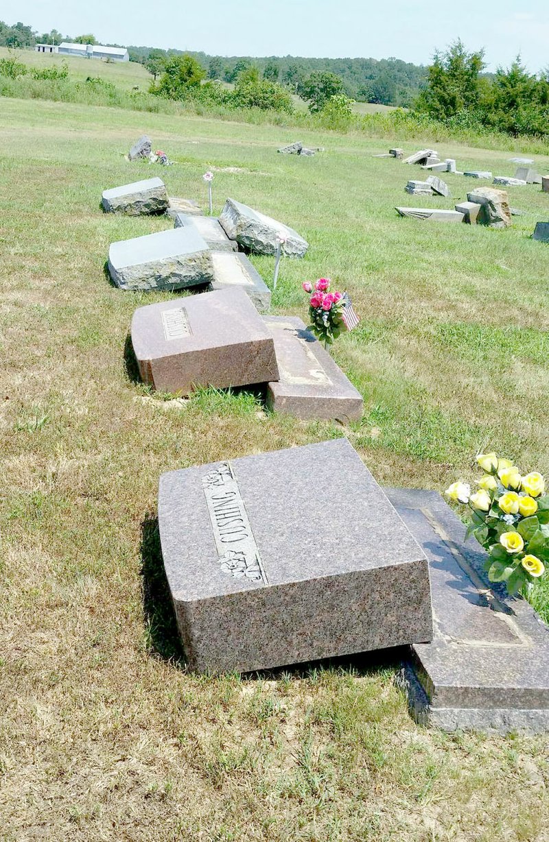 COURTESY PHOTO Vandals damaged about 39 headstones at Beaty Cemetery near Lincoln last week. Washington County Sheriff's Office is investigating the incident.