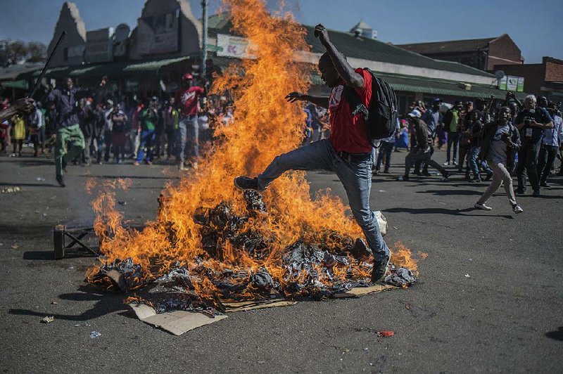 Supporters of the Movement for Democratic Change, Zimbabwe’s main opposition party, protest in the streets of Harare after election results were announced Wednesday.