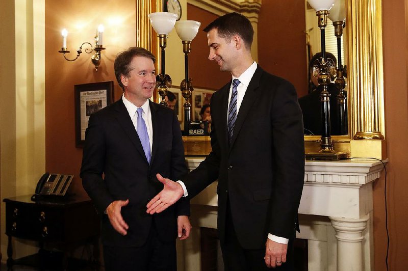 Sen. Tom Cotton, R-Ark., (right) shakes hands with U.S. Supreme Court nominee Brett Kavanaugh during a photo opportunity Wednesday on Capitol Hill.