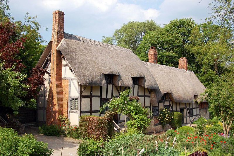 The thatched roof of Anne Hathaway’s Cottage, where Shakespeare’s wife grew up, seems to drip over the 500-year-old building.