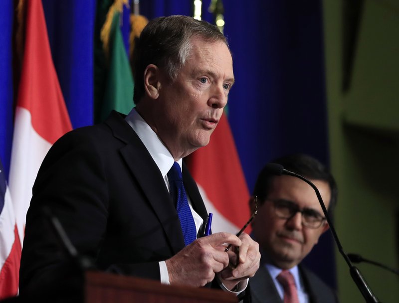 FILE - In this Oct. 17, 2017 file photo, United States Trade Representative Robert Lighthizer, left, with Mexico's Secretary of Economy Ildefonso Guajardo Villarreal, right, speaks during the conclusion of the fourth round of negotiations for a new North American Free Trade Agreement (NAFTA) in Washington. Gathering strength for a potentially brutal trade war with China, the United States is trying to patch things up with its friends. U.S. and Mexican negotiators are meeting Thursday and Friday to work on a rewrite of the North American Free Trade Agreement -- a deal that looked virtually dead a few months ago. And last week the Trump administration reached a cease-fire with Europe in a dispute over autos.  (AP Photo/Manuel Balce Ceneta)