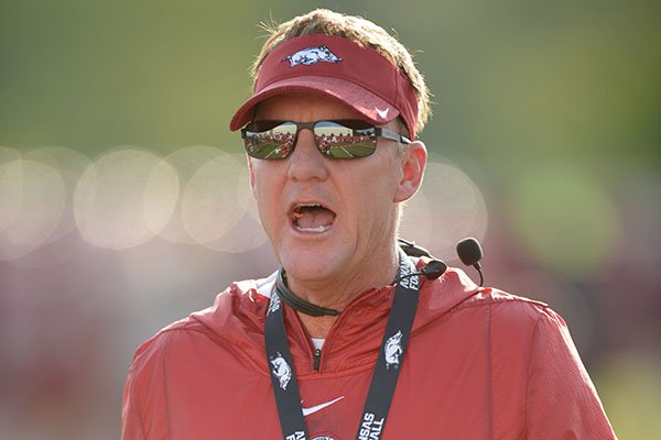 Arkansas coach Chad Morris directs his players Friday, Aug. 3, 2018, during practice at the university practice field on campus in Fayetteville. 