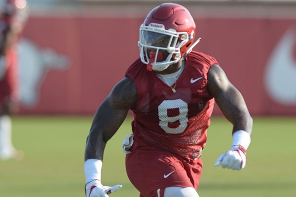 Arkansas linebacker De'Jon Harris participates in a drill Friday, Aug. 3, 2018, during practice at the university practice field on campus in Fayetteville.