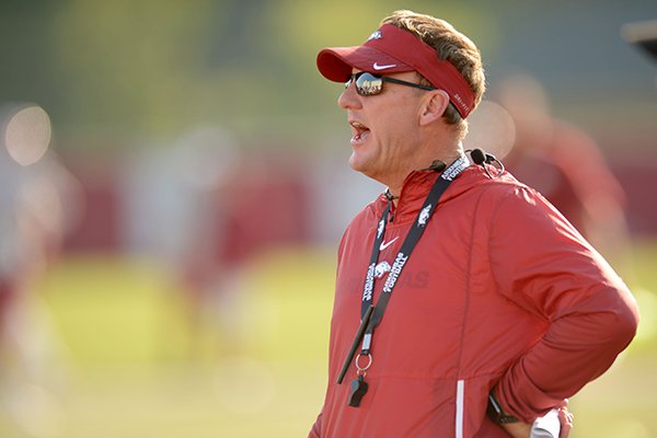 Arkansas coach Chad Morris directs his players Friday, Aug. 3, 2018, during practice at the university practice field on campus in Fayetteville. Visit nwadg.com/photos to see more photographs from the practice.