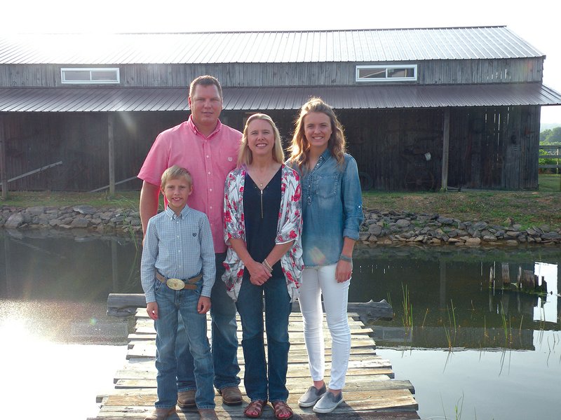 The Chris Davis family of Drasco is the 2018 Cleburne County Farm Family of the Year. Family members include, from left, Tyler, Chris, Lisa and Kaleah. Chris and Lisa call their operation the Paisley Defoor Farm to honor the family members that introduced them to farming.