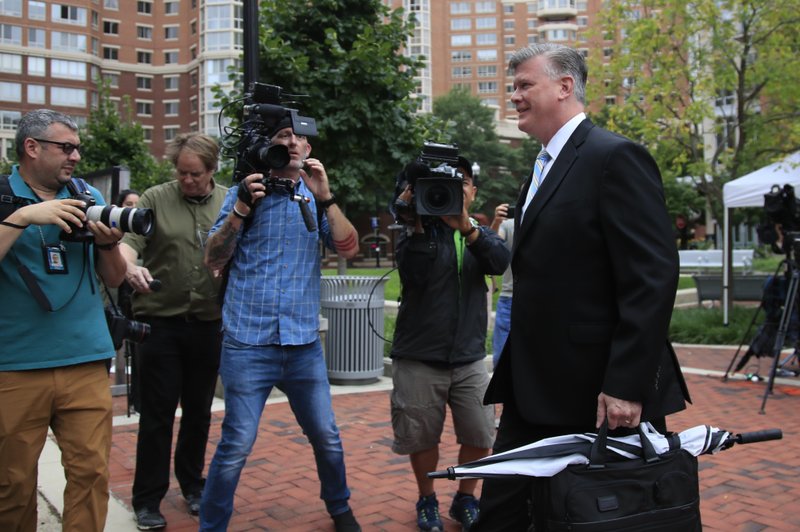 Kevin Downing, attorney for Paul Manafort, walks to the Alexandria Federal Courthouse in Alexandria, Va., Friday, Aug. 3, 2018, on day four of President Donald Trump's former campaign chairman Paul Manafort's tax evasion and bank fraud trial. (AP Photo/Manuel Balce Ceneta)