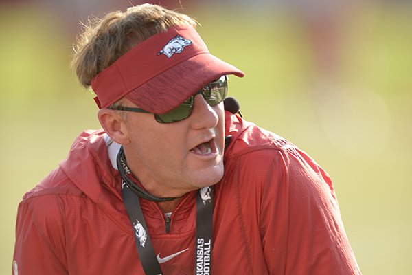 Arkansas coach Chad Morris directs his players Friday, Aug. 3, 2018, during practice at the university practice field on campus in Fayetteville. 