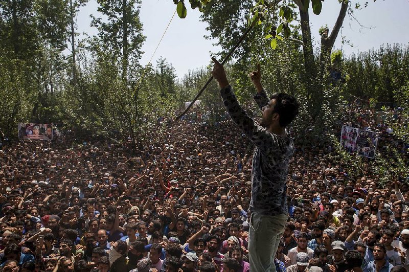 Kashmiri villagers shout slogans during the funeral Saturday for a rebel commander and four others killed by Indian forces south of Srinagar.