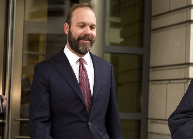 FILE - In this Feb. 23, 2018, file photo, Rick Gates leaves federal court in Washington. Paul Manafort&#x2019;s trial opened this week with a display of his opulent lifestyle and testimony about what prosecutors say were years of financial deception. But the most critical moment in the former Trump campaign chairman&#x2019;s financial fraud trial will arrive next week with the testimony of his longtime associate Gates.(AP Photo/Jose Luis Magana, File)