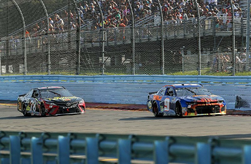 Chase Elliott (right) leads Martin Truex Jr. with seven laps to go during Sunday’s NASCAR Monster Energy Cup Series race in Watkins Glen, N.Y.