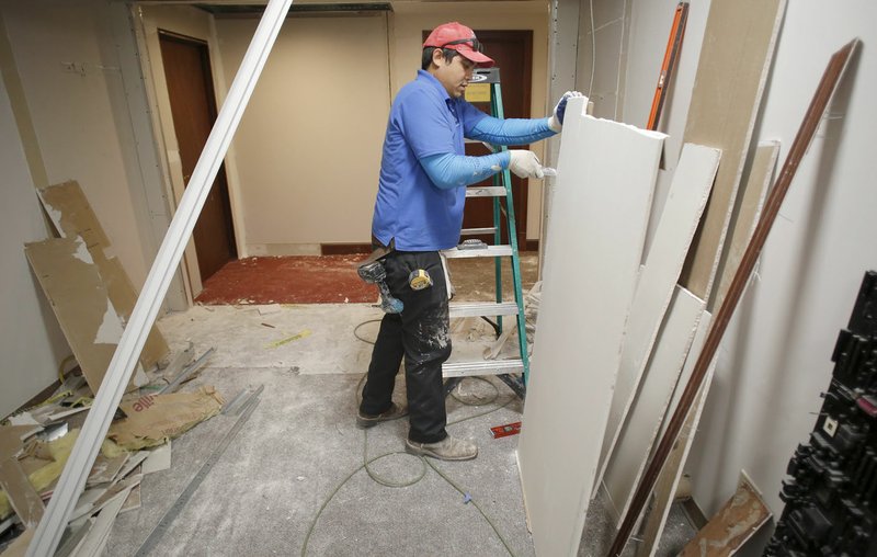 NWA Democrat-Gazette/DAVID GOTTSCHALK Work by JT Handyman continues Friday on the fifth floor of the Washington County Courthouse in Fayetteville. The fifth floor is being remodeled to house a courtroom.