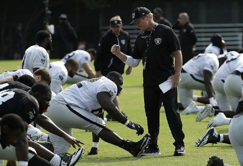 Jon Gruden, back in the NFL directing the Oakland Raiders, counts on a lot from longtime associate Jeff Leonardo, whom Gruden proudly praises for his stint as the bus driver for rock groups such as AC/DC.