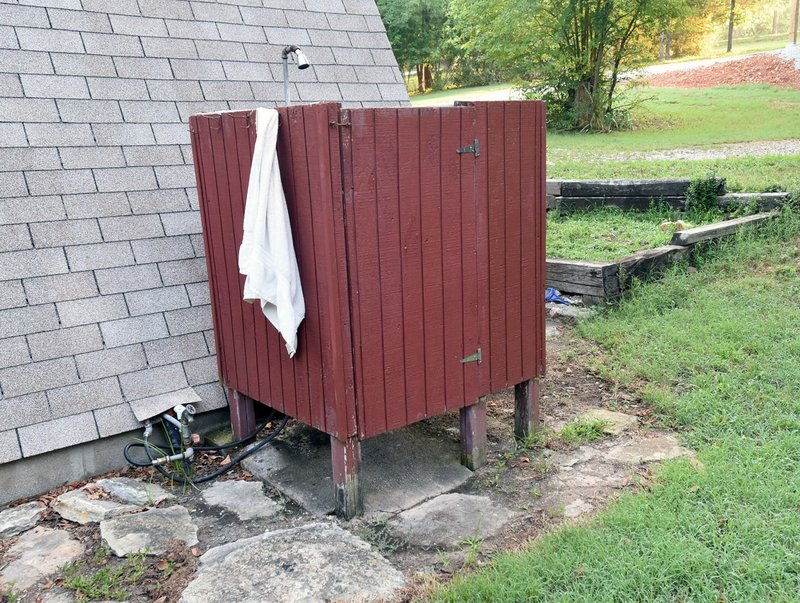 NWA Democrat-Gazette/FLIP PUTTHOFF An outdoor shower is easy to build and a refreshing way to cool off on a hot day.