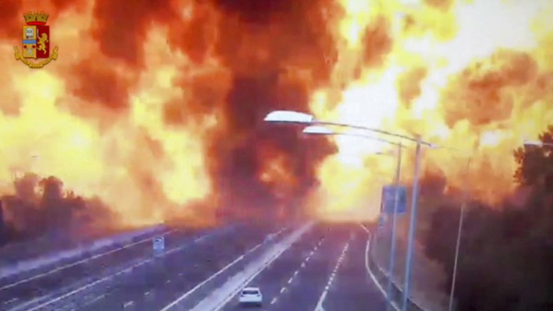 In this frame grab taken from a video released by the Italian police, the moment a truck that was transporting flammable substances explodes after colliding with another truck on a highway in the outskirts of Bologna, Italy, Monday, Aug. 6, 2018. The explosion killed at least two people and injured up to 70 as a section of the thoroughfare collapsed, police said. (Italian Police video via AP)
