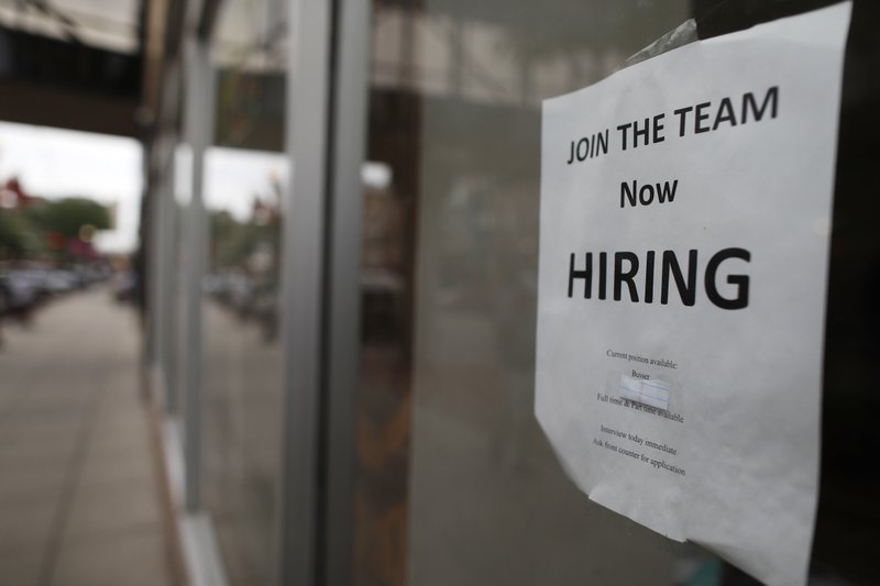 In this July 18 photograph, a "now hiring" sign hangs in the window of a Chinese restaurant in downtown Fargo, N.D. Data shows that small businesses are hiring less, despite the strong economy, partly because they are losing employees to bigger firms. (AP Photo/David Zalubowski)
