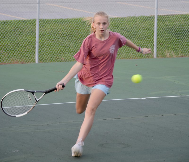 Graham Thomas/Herald-Leader Siloam Springs junior Trey Hardcastle returns a serve Monday during tennis practice at the John Brown University Tennis Complex. The Panthers open the season Aug. 16 at home against Alma.