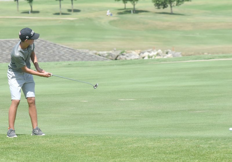 Neal Denton/Special to the Herald-Leader Siloam Springs junior Evan Sauer putts onto the green Monday at the Ultimate Auto Group High School Invitational at Big Creek Golf and Country Club in Mountain Home. The tournament continued on Tuesday. Results were not available at presstime.