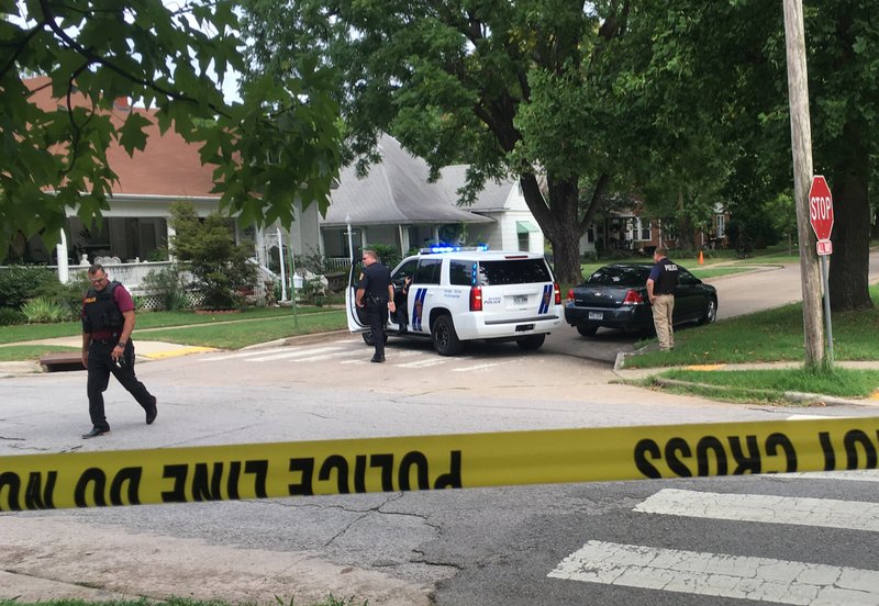 NWA Democrat-Gazette/FLIP PUTTHOFF The Rogers Police Department set up a barricade at Third and Persimmon Streets in Rogers.