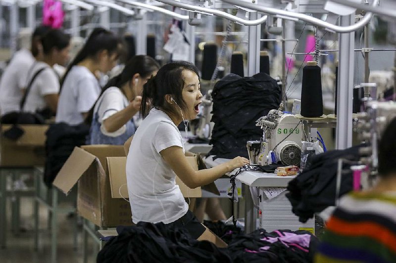 Workers make swimming suits last week in a factory in Jinjiang, China. China announced Wednesday that it would impose 25 percent punitive duties on $16 million of U.S. goods after the Trump administration announced similar duties on Chinese goods Tuesday.  