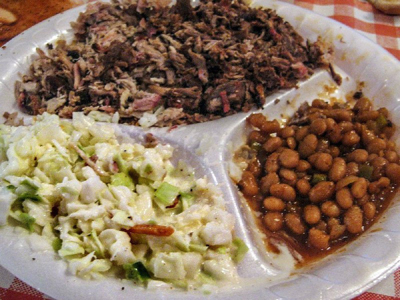 A chopped pork and beef barbecue plate at the Smoke Shack in Maumelle is served with potato salad, baked beans and a toasted bun. 
