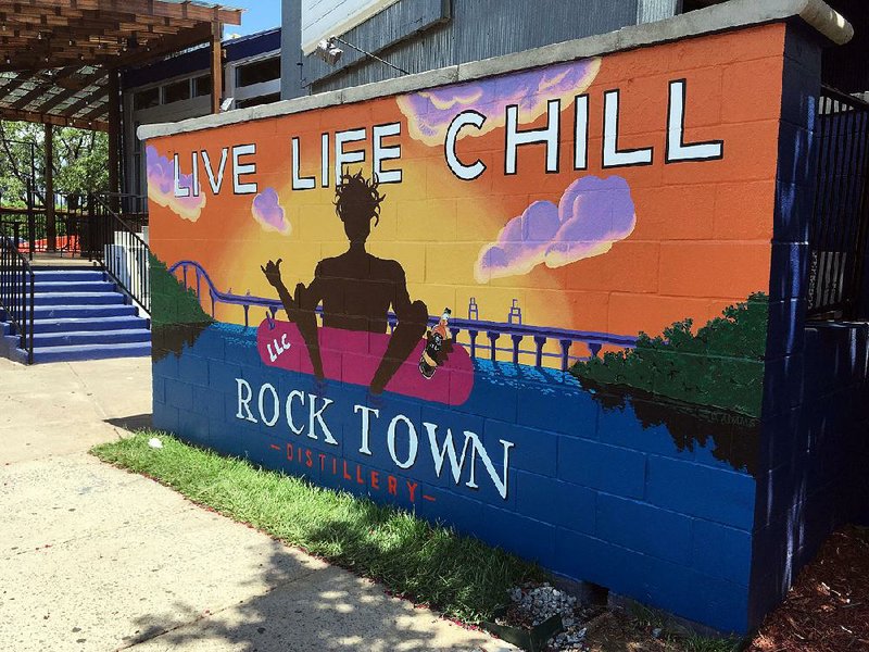 A brightly colored sign portends the opening of Live Life Chill in the former Revolution Room restaurant, 300 President Clinton Ave. in Little Rock’s River Market.  