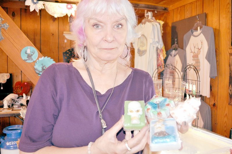 RACHEL DICKERSON/MCDONALD COUNTY PRESS Jann Britton of Bella Vista, Ark., has a variety of shapes of soaps for sale at The Treasure Shed in Jane. She says soap-making is her addiction.